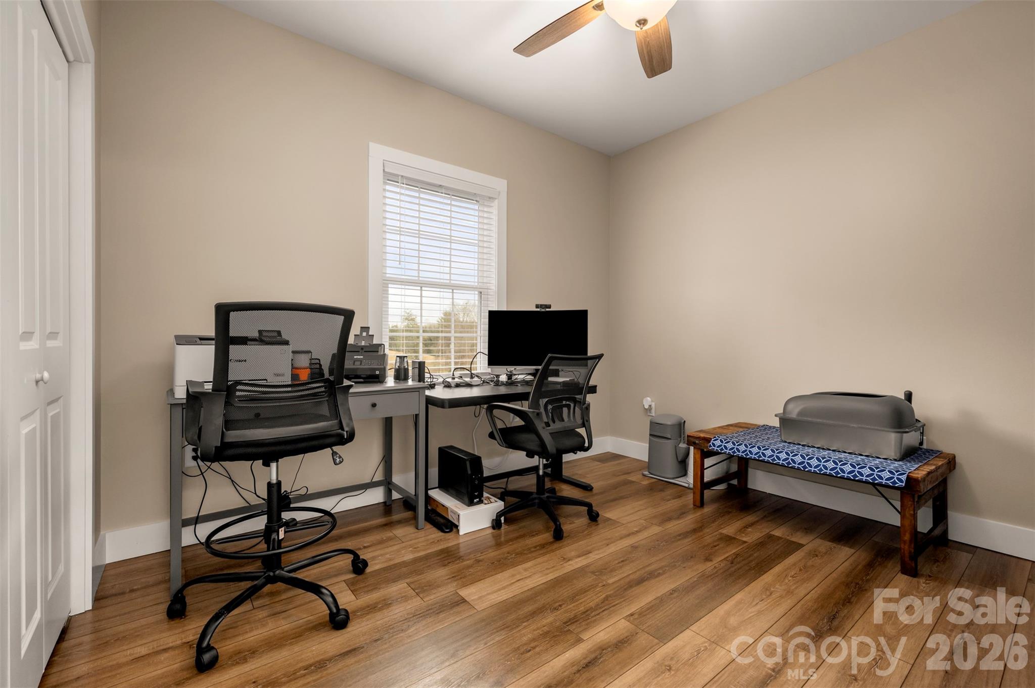 457 Edwards Street Extension Rutherfordton, NC 28139 - Photo 11 of 39 a view of a workspace with furniture and a window