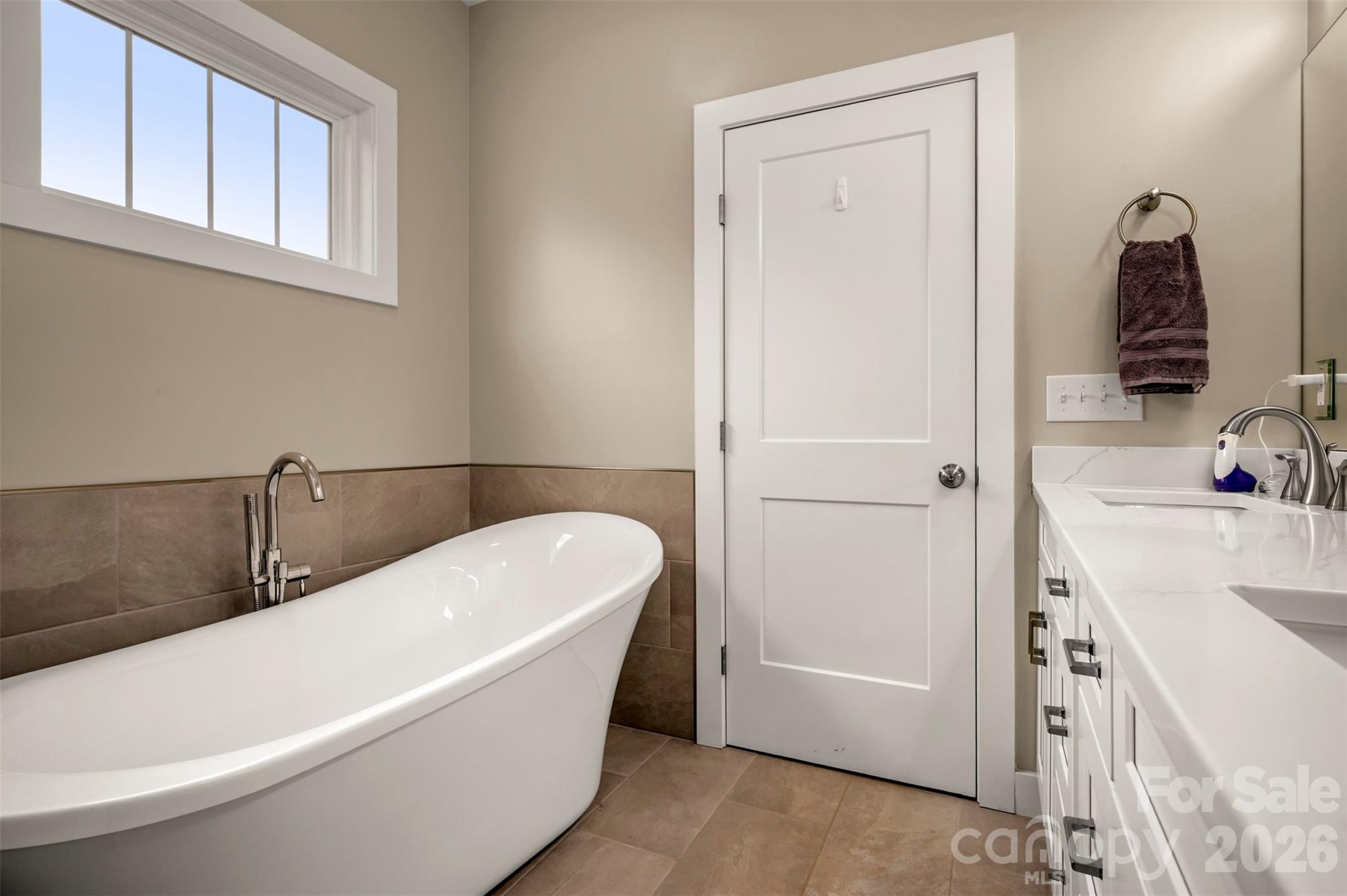 457 Edwards Street Extension Rutherfordton, NC 28139 - Photo 18 of 39 a bathroom with a tub a sink and a mirror