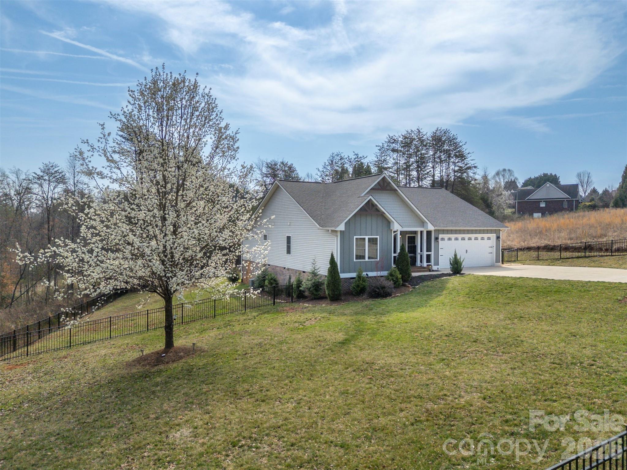 457 Edwards Street Extension Rutherfordton, NC 28139 - Photo 24 of 39 a wooden house with a big yard and large trees