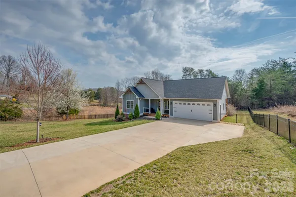 front view of a house with a big yard