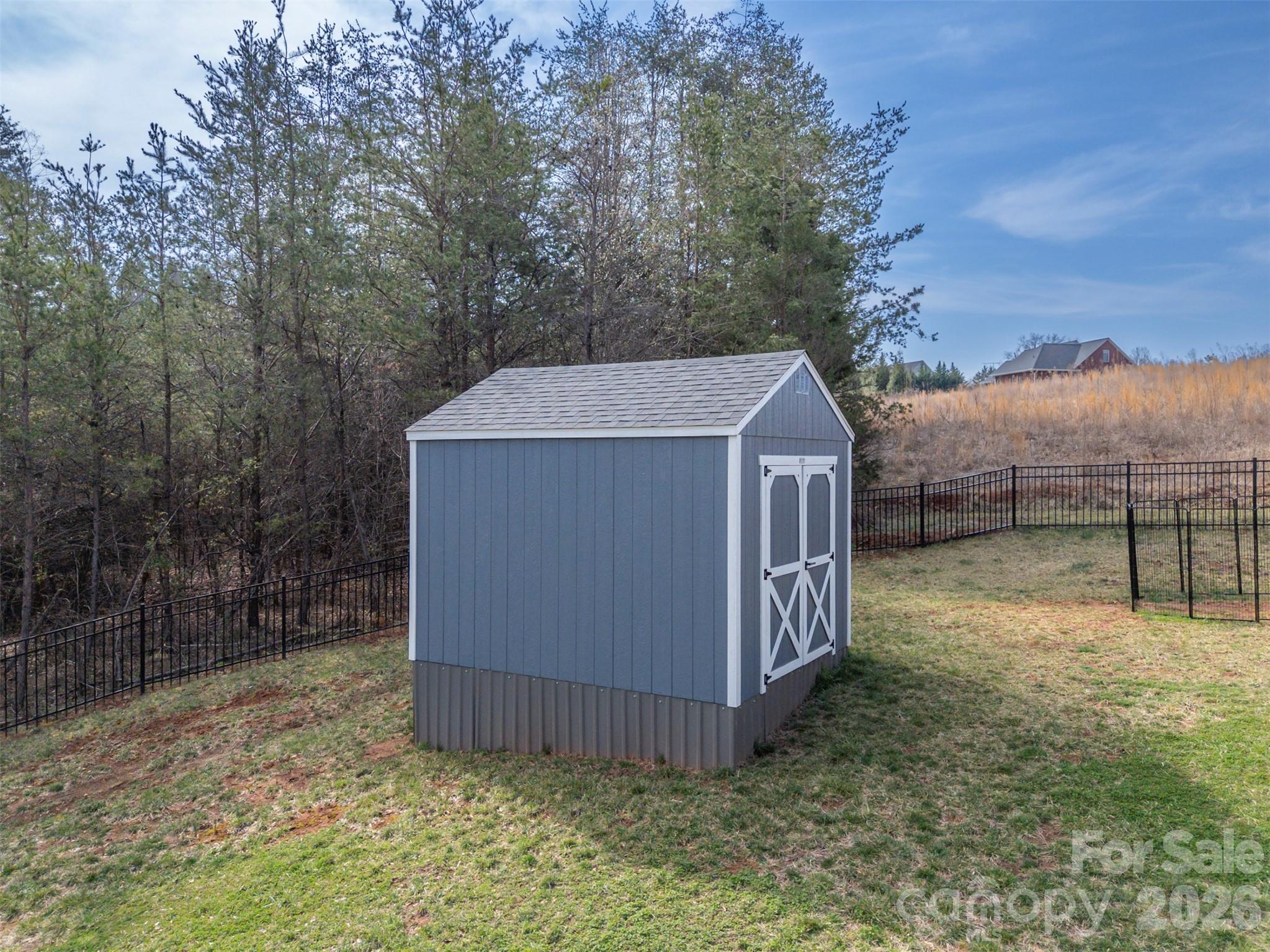 457 Edwards Street Extension Rutherfordton, NC 28139 - Photo 37 of 39 a view of a wooden house with a yard and large tree