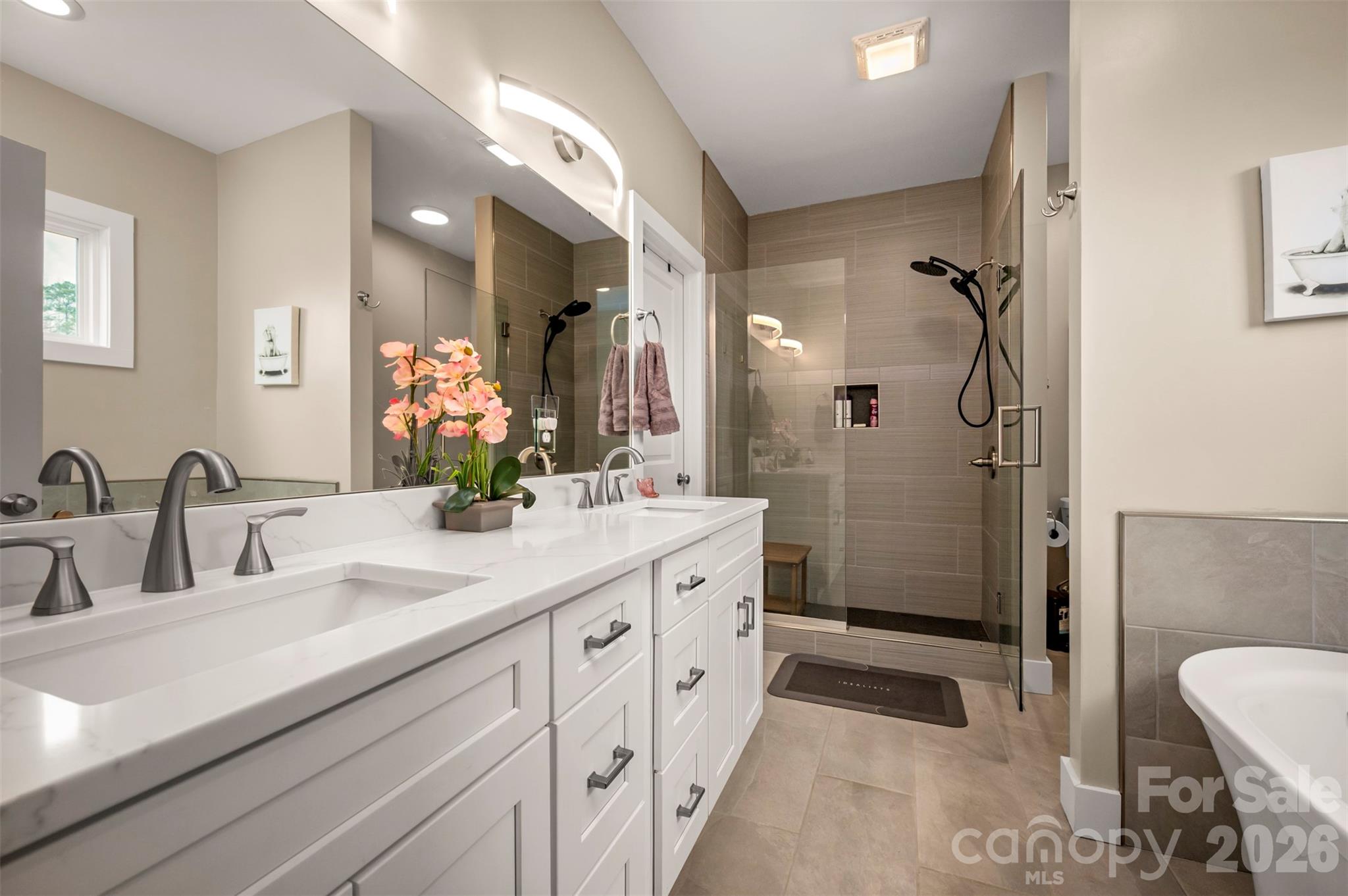 457 Edwards Street Extension Rutherfordton, NC 28139 - Photo 8 of 39 a spacious bathroom with a double vanity sink mirror double and shower