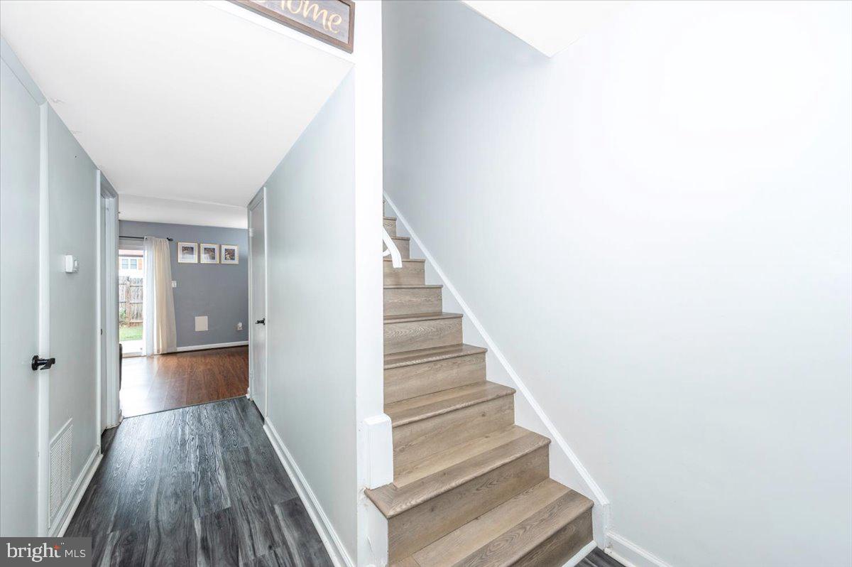 8826 Stauffer Road Walkersville, MD 21793 - Photo 20 of 38 a view of a hallway with wooden floor and entryway