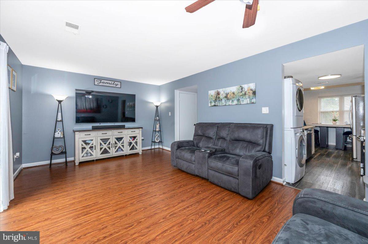 8826 Stauffer Road Walkersville, MD 21793 - Photo 6 of 38 a living room with furniture and a flat screen tv