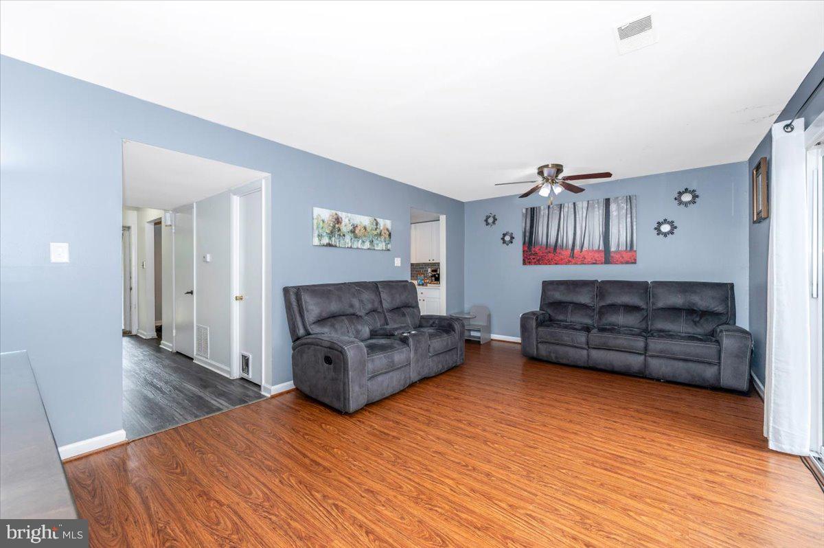 8826 Stauffer Road Walkersville, MD 21793 - Photo 7 of 38 a living room with furniture and a wooden floor