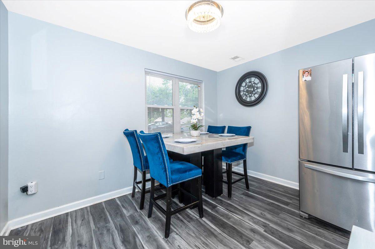 8826 Stauffer Road Walkersville, MD 21793 - Photo 8 of 38 a view of a dining room with a table and chairs