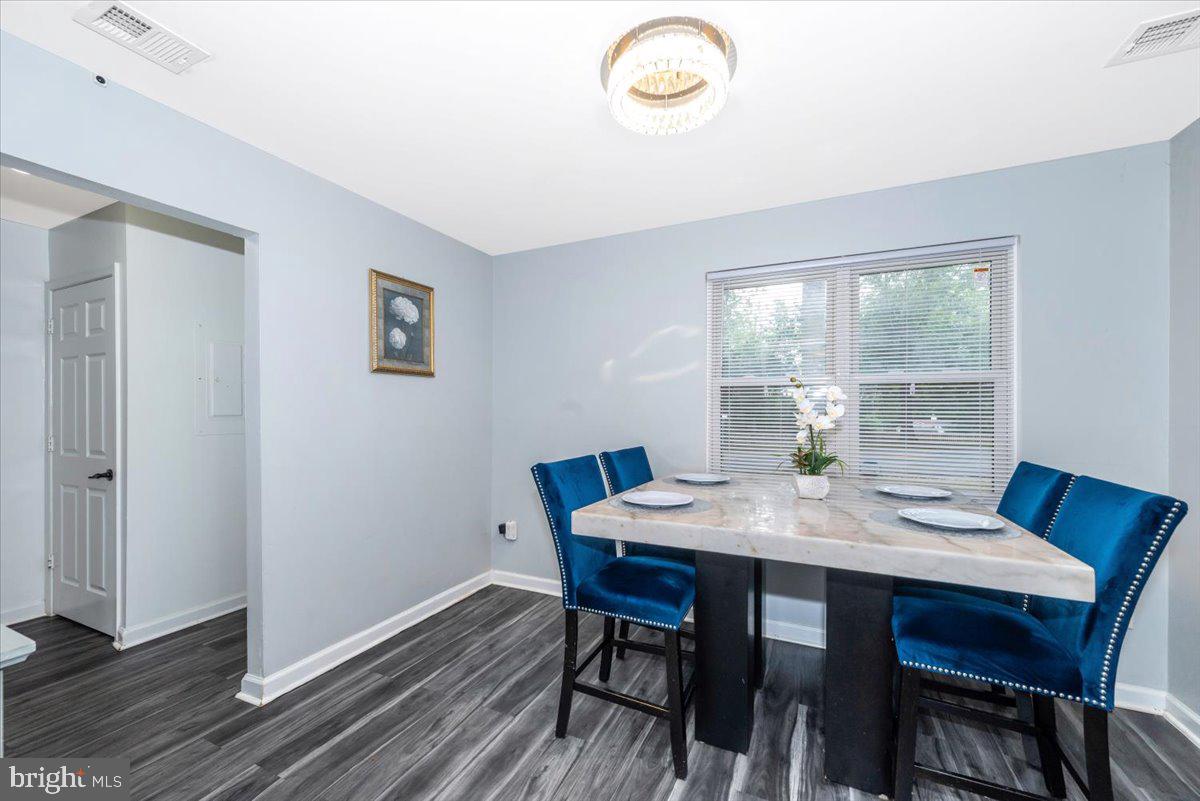 8826 Stauffer Road Walkersville, MD 21793 - Photo 10 of 38 a view of a dining room with furniture window and wooden floor