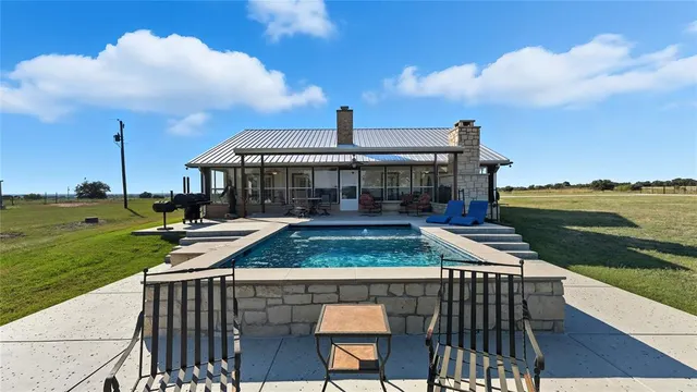 a view of a roof deck with couches and city view