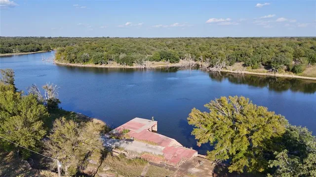 a view of a lake with houses with outdoor space