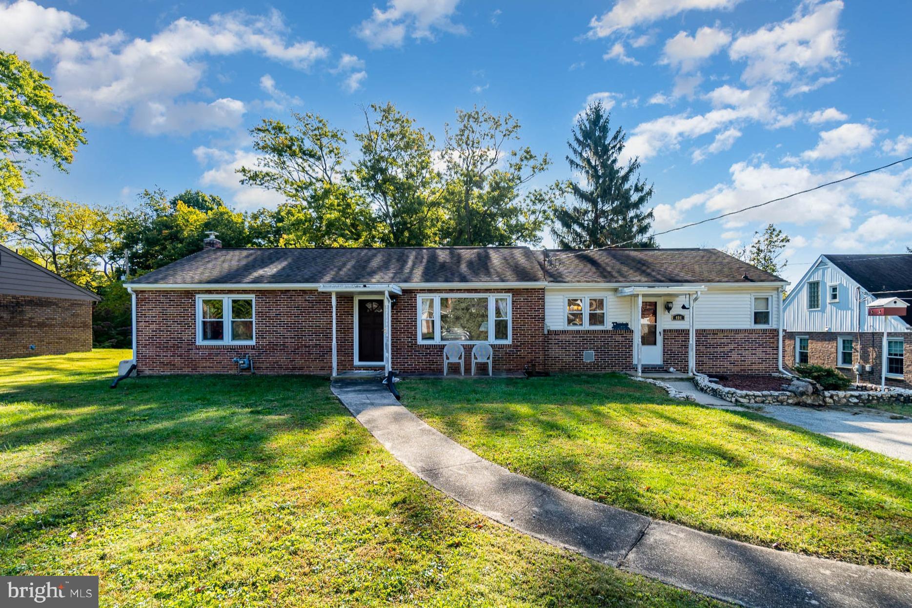 404 Beaumont Road York, PA 17403 - Photo 1 of 26 a view of a house with a big yard potted plants and large tree