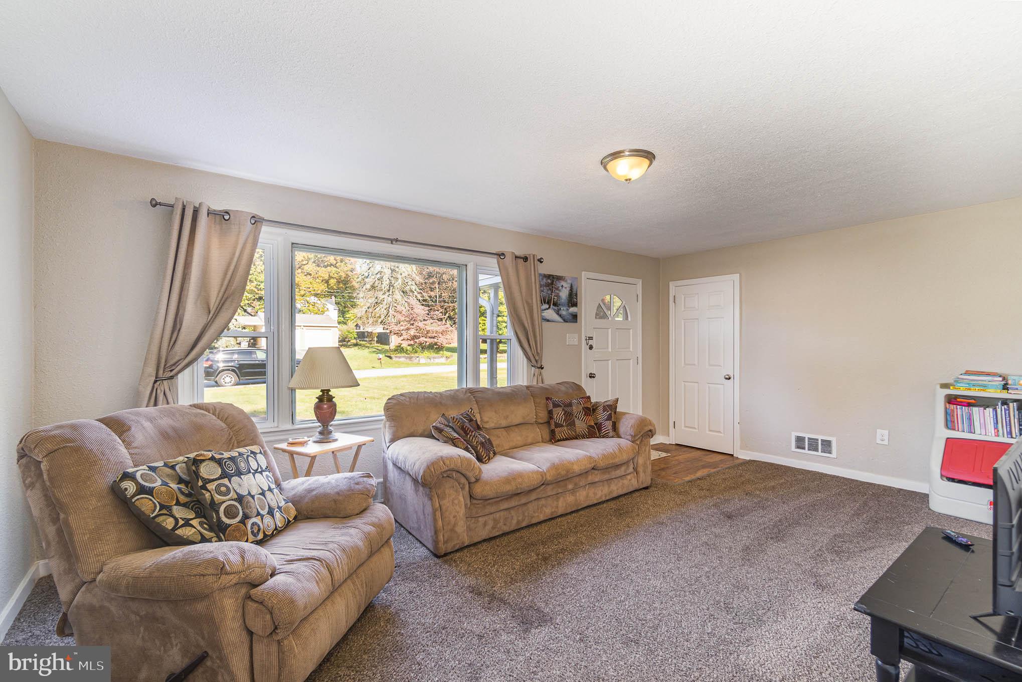 404 Beaumont Road York, PA 17403 - Photo 11 of 26 a living room with furniture and a large window