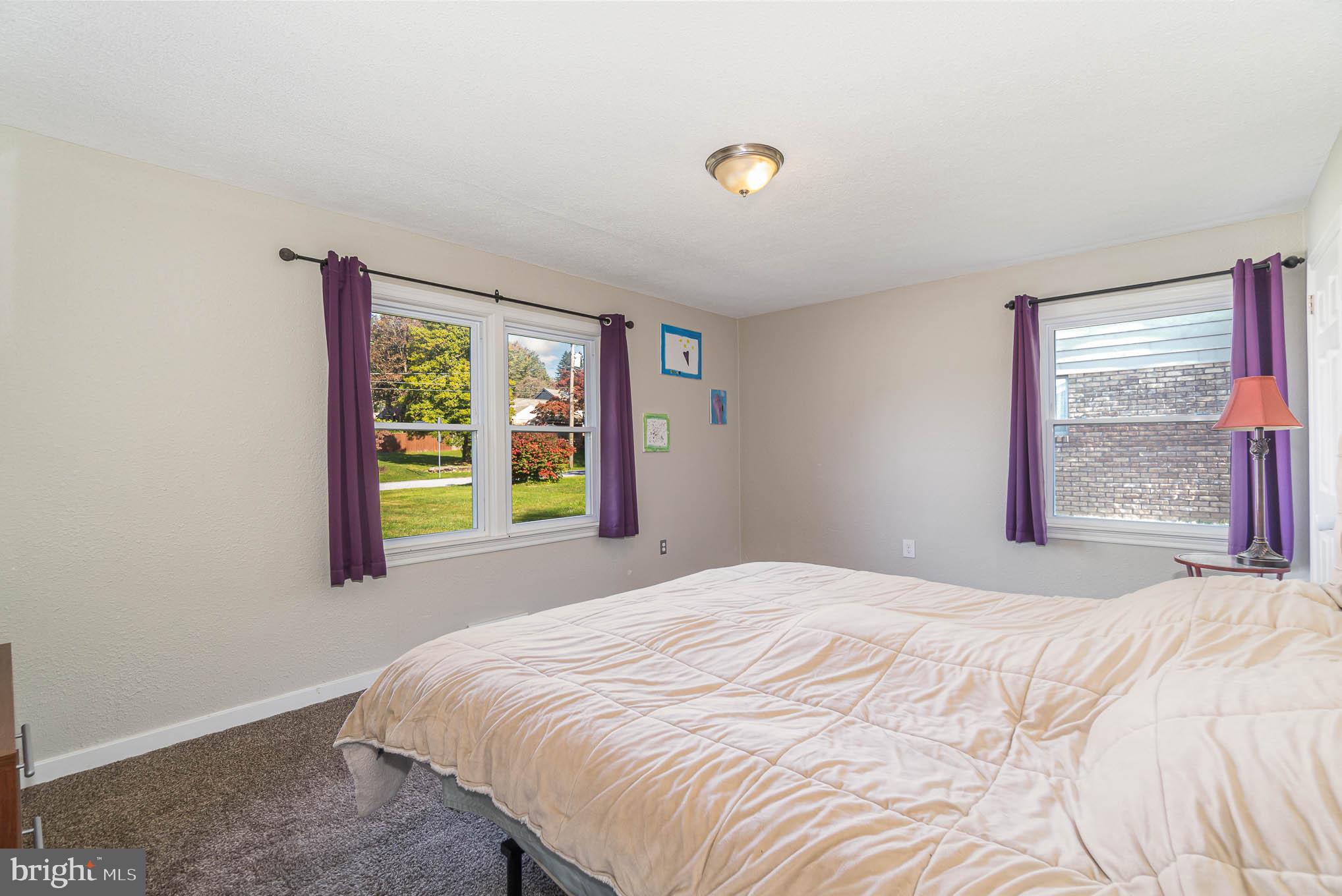 404 Beaumont Road York, PA 17403 - Photo 17 of 26 a bedroom with a bed and a window