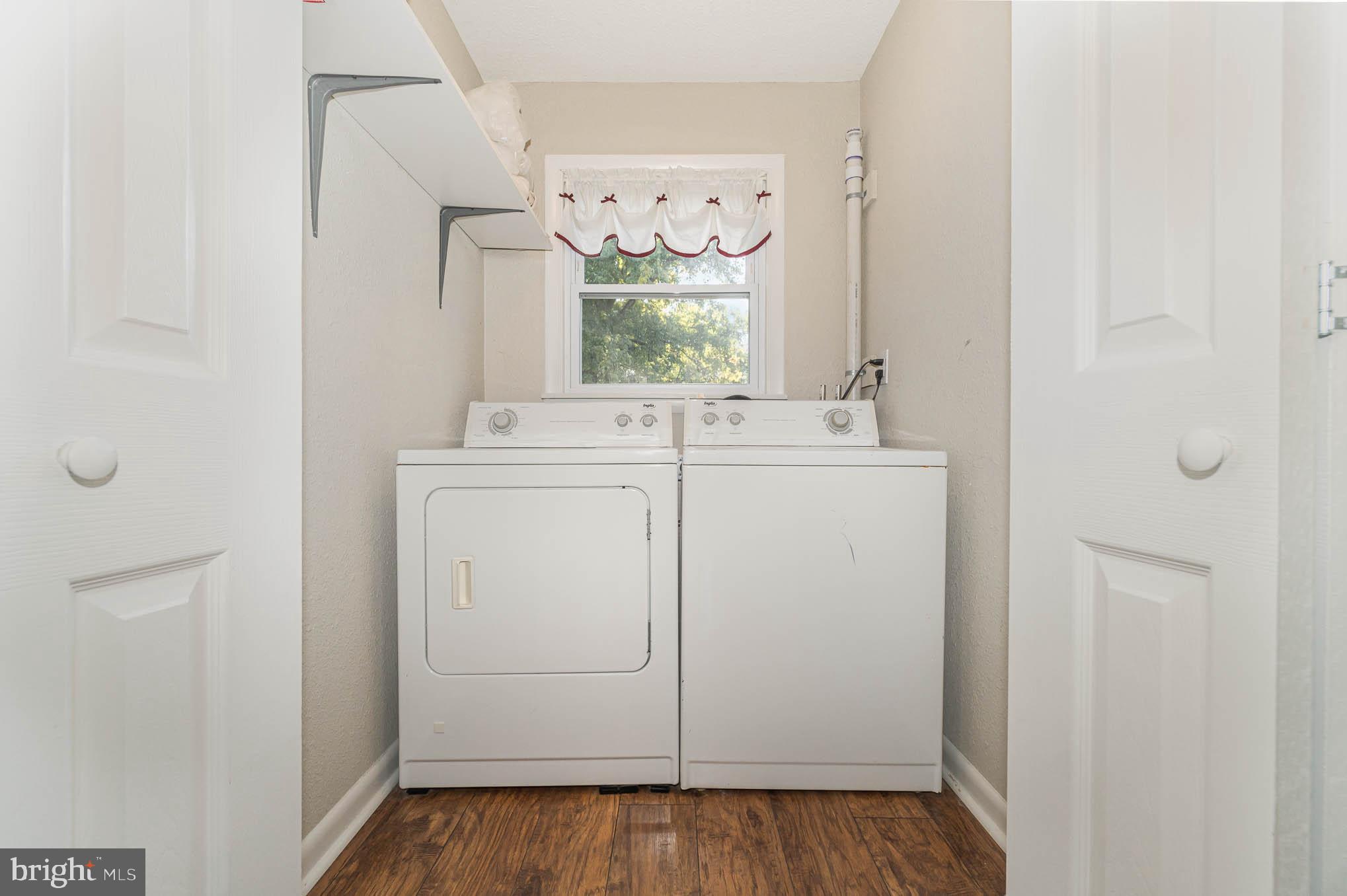 404 Beaumont Road York, PA 17403 - Photo 19 of 26 a utility room with cabinets washer and dryer
