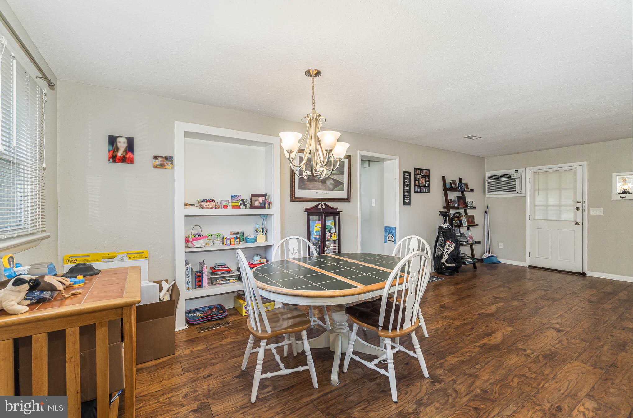404 Beaumont Road York, PA 17403 - Photo 7 of 26 a dining room with furniture a chandelier and wooden floor