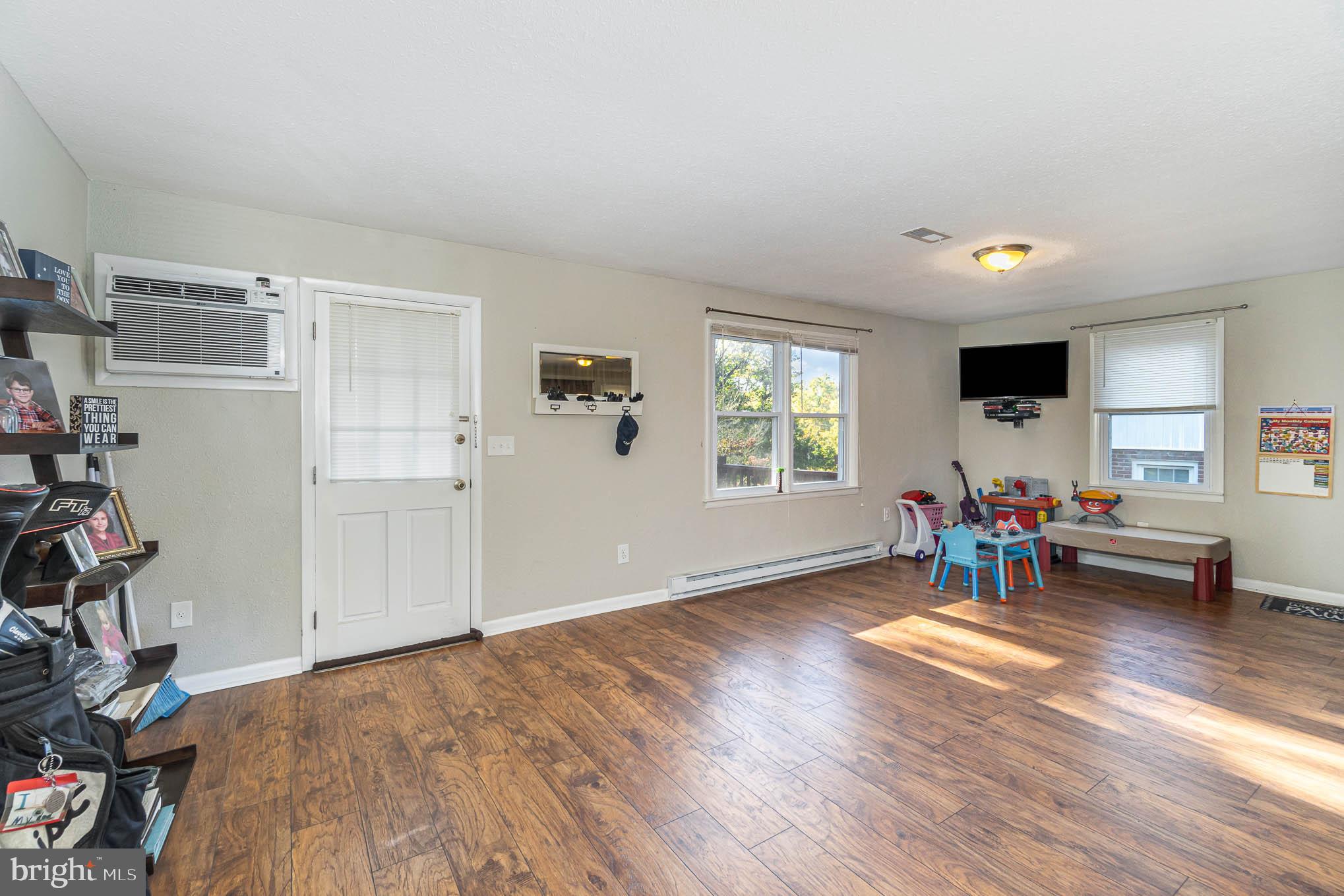 404 Beaumont Road York, PA 17403 - Photo 9 of 26 an empty room with furniture and windows
