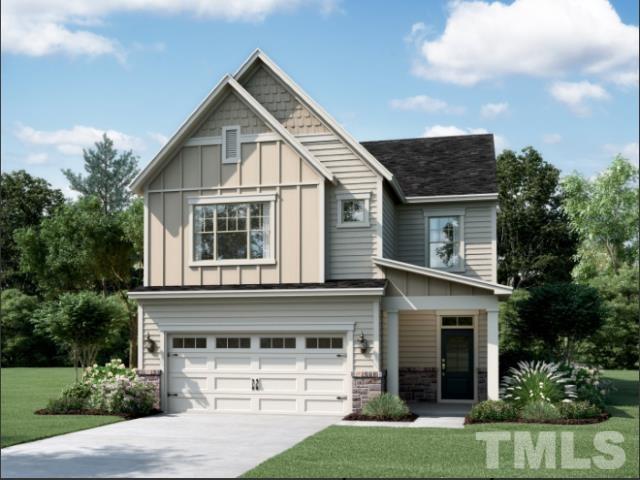 2387 Kettle Falls Station, Unit 222 Apex, NC 27502 - Photo 1 of 13 a front view of a house with a yard and garage