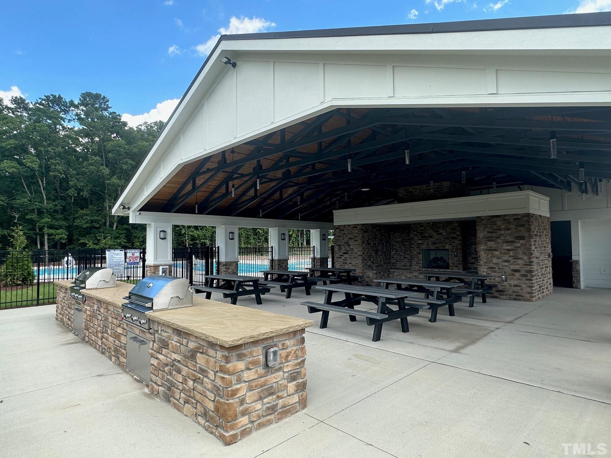 2387 Kettle Falls Station, Unit 222 Apex, NC 27502 - Photo 13 of 13 a building outdoor space with patio furniture and potted plants
