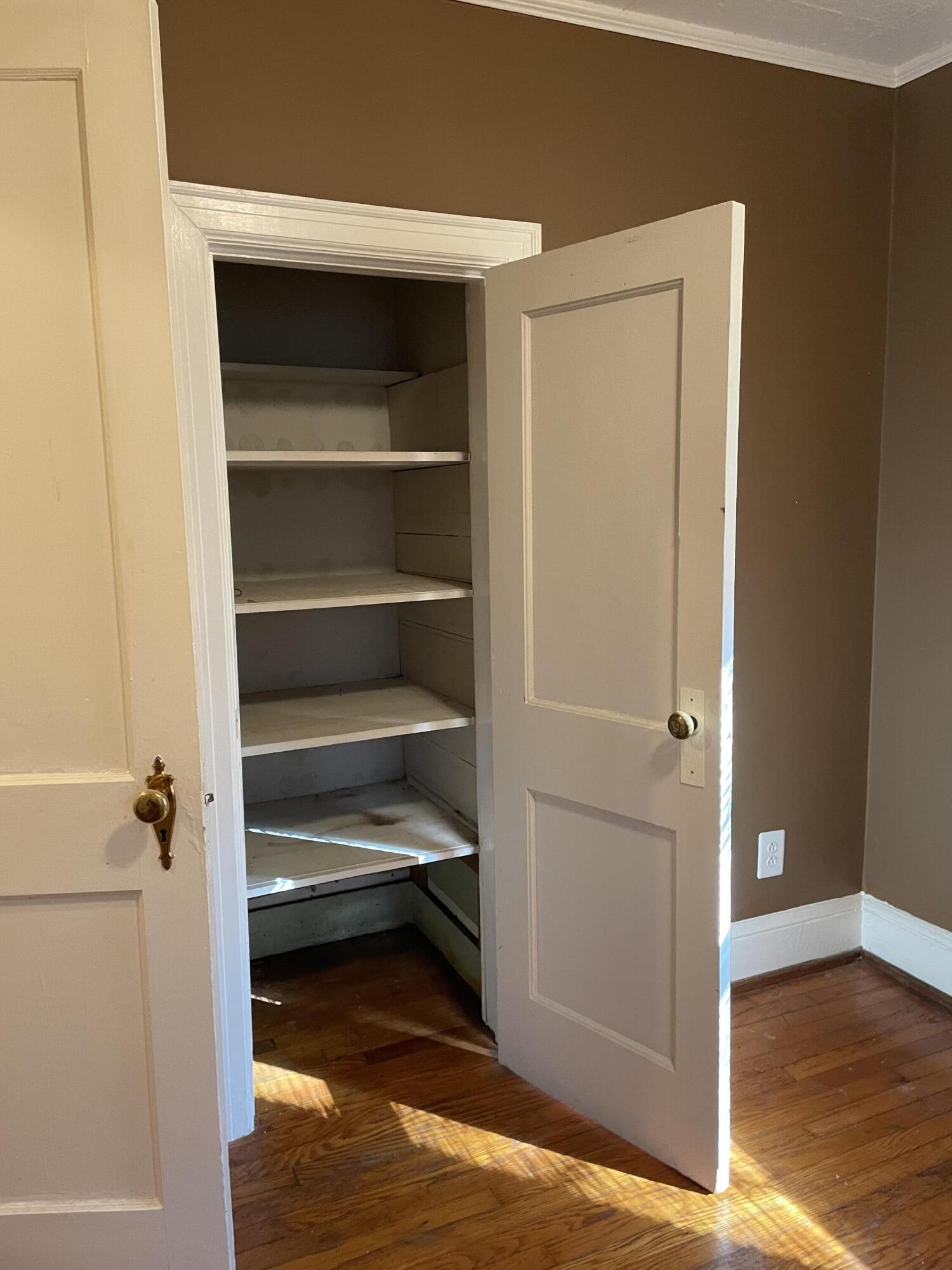 1152 Hamilton Avenue Southwest Roanoke, VA 24015 - Photo 27 of 36 a view of walk in closet with empty racks