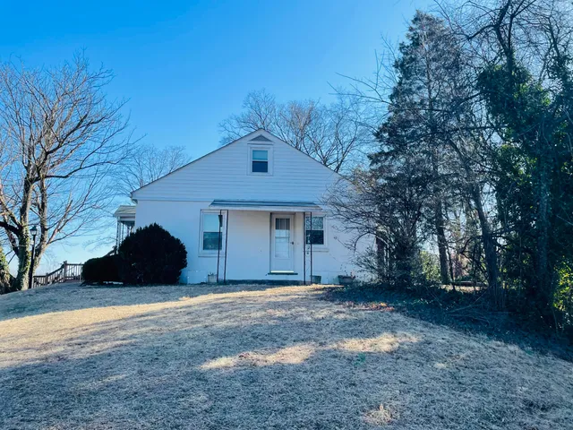 a kitchen with a stove a refrigerator and a cabinets