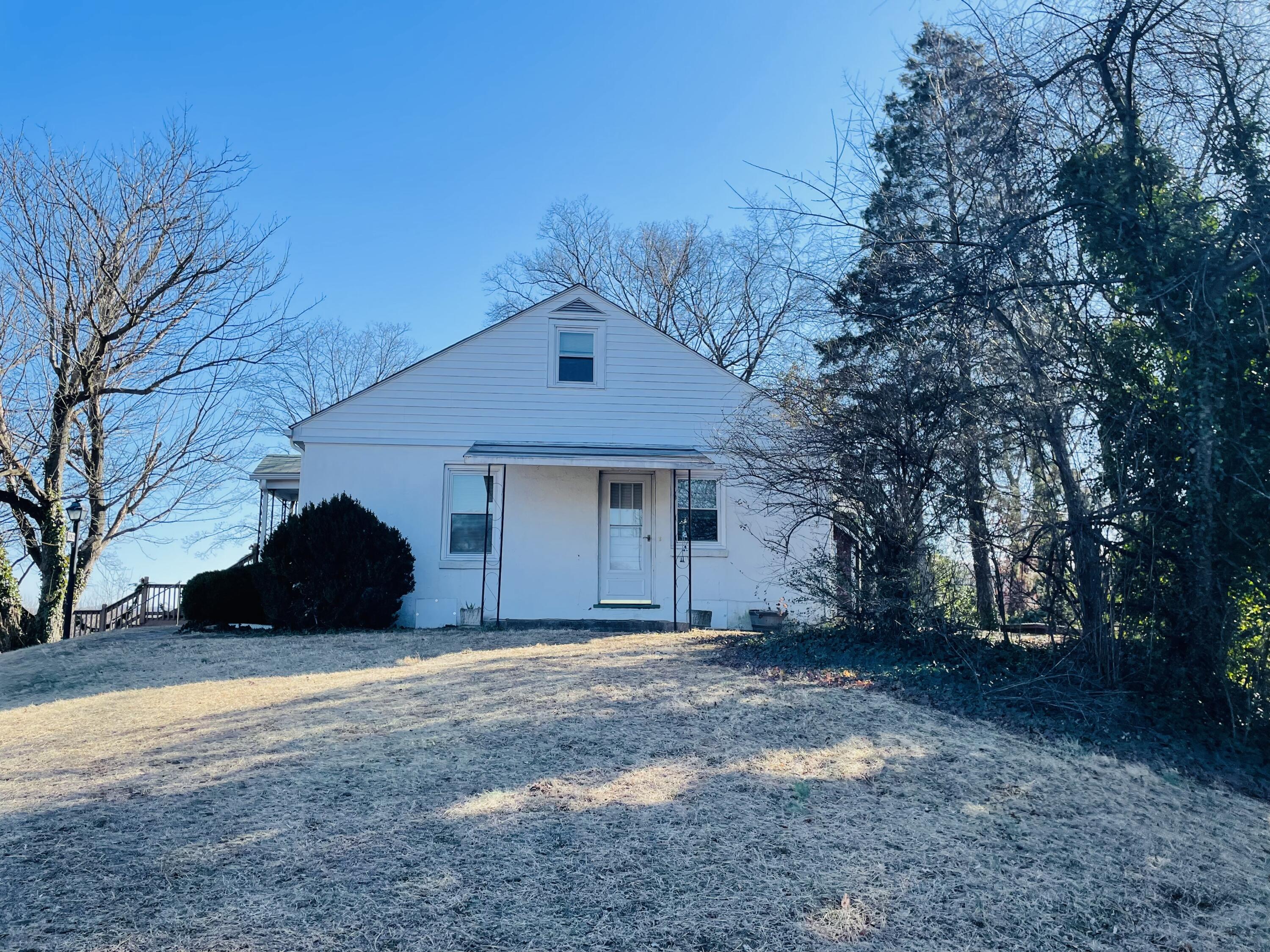 1152 Hamilton Avenue Southwest Roanoke, VA 24015 - Photo 6 of 36 a front view of a house with a yard