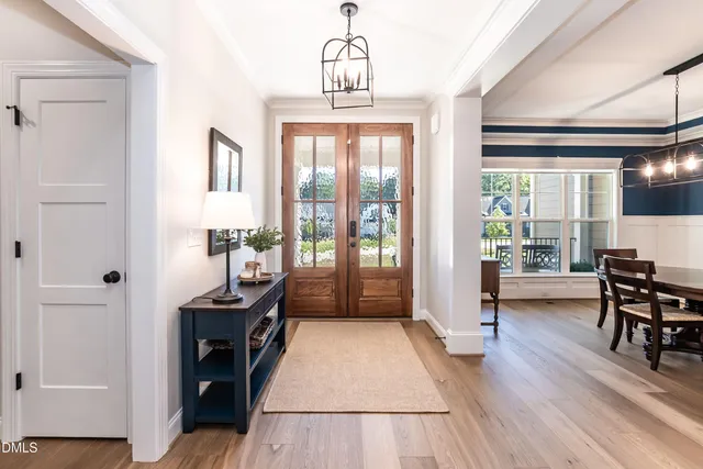 a view of a livingroom with furniture window and wooden floor