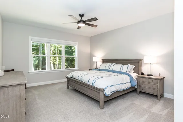 a bathroom with a granite countertop sink mirror and a bathtub