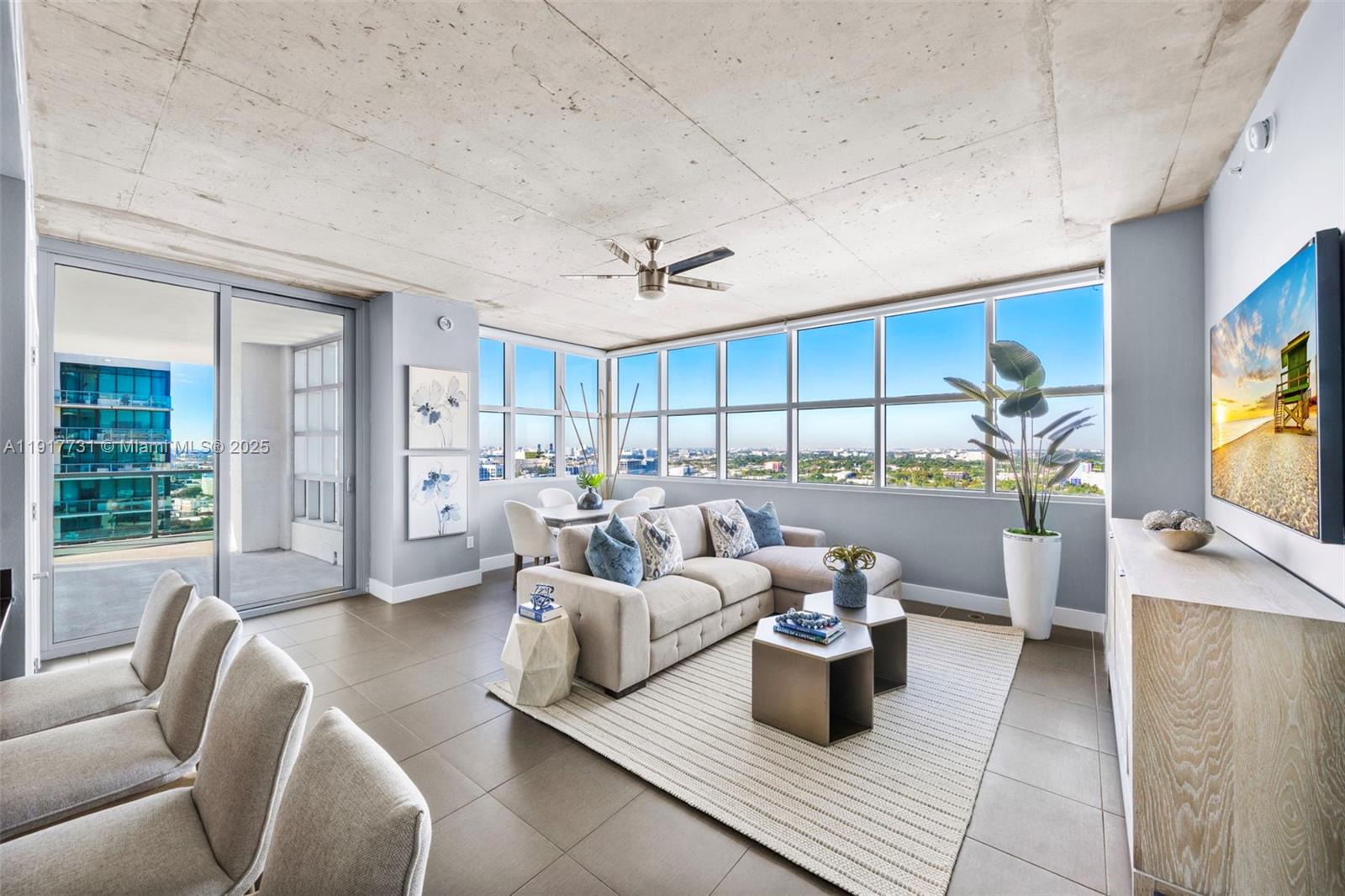 a living room with furniture and a flat screen tv