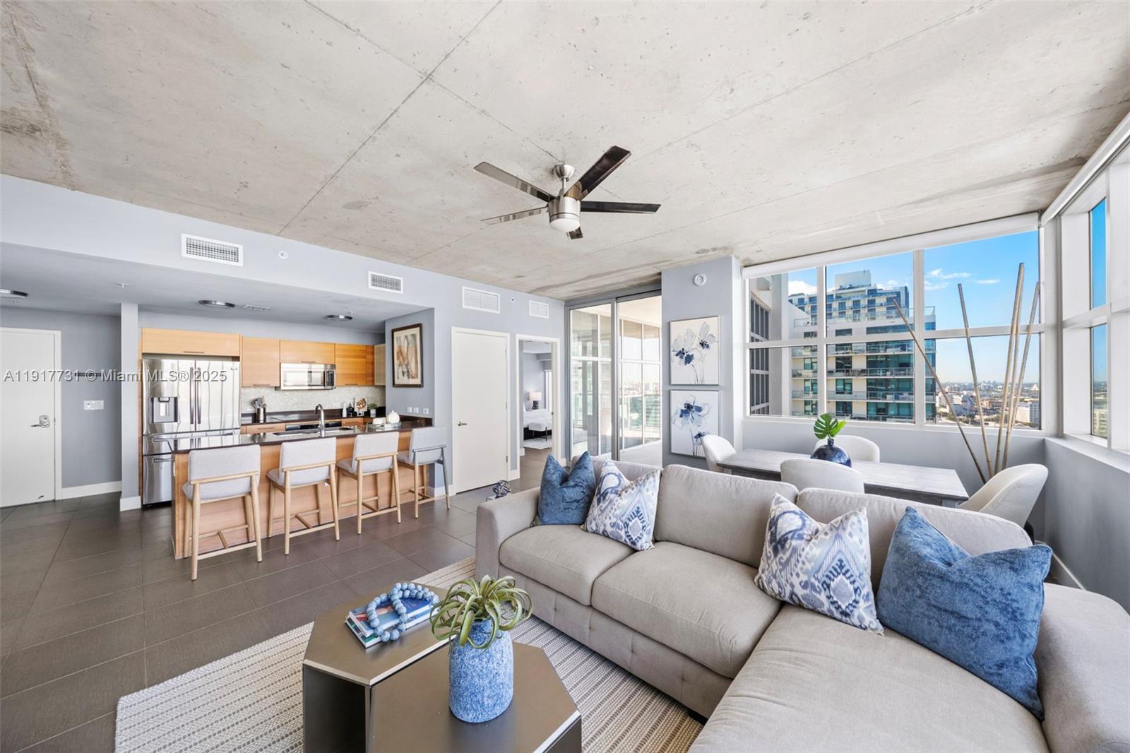 3301 Northeast 1st Avenue, Unit H2201 Miami, FL 33137 - Photo 11 of 46 a living room with furniture and a large window