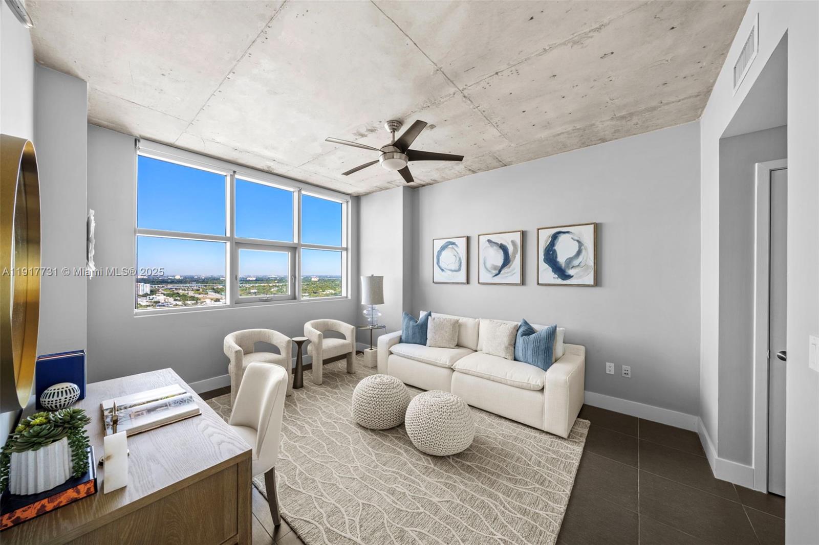3301 Northeast 1st Avenue, Unit H2201 Miami, FL 33137 - Photo 12 of 46 a living room with furniture and a large window
