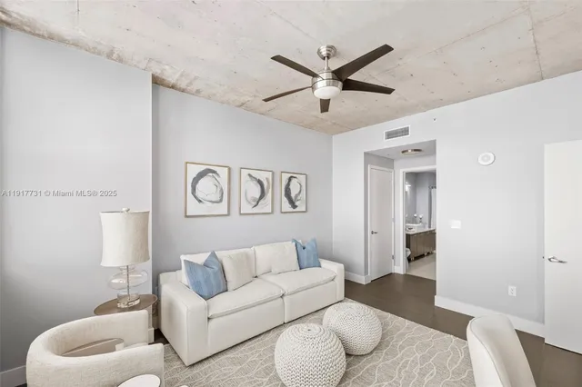 a living room with furniture and a rug