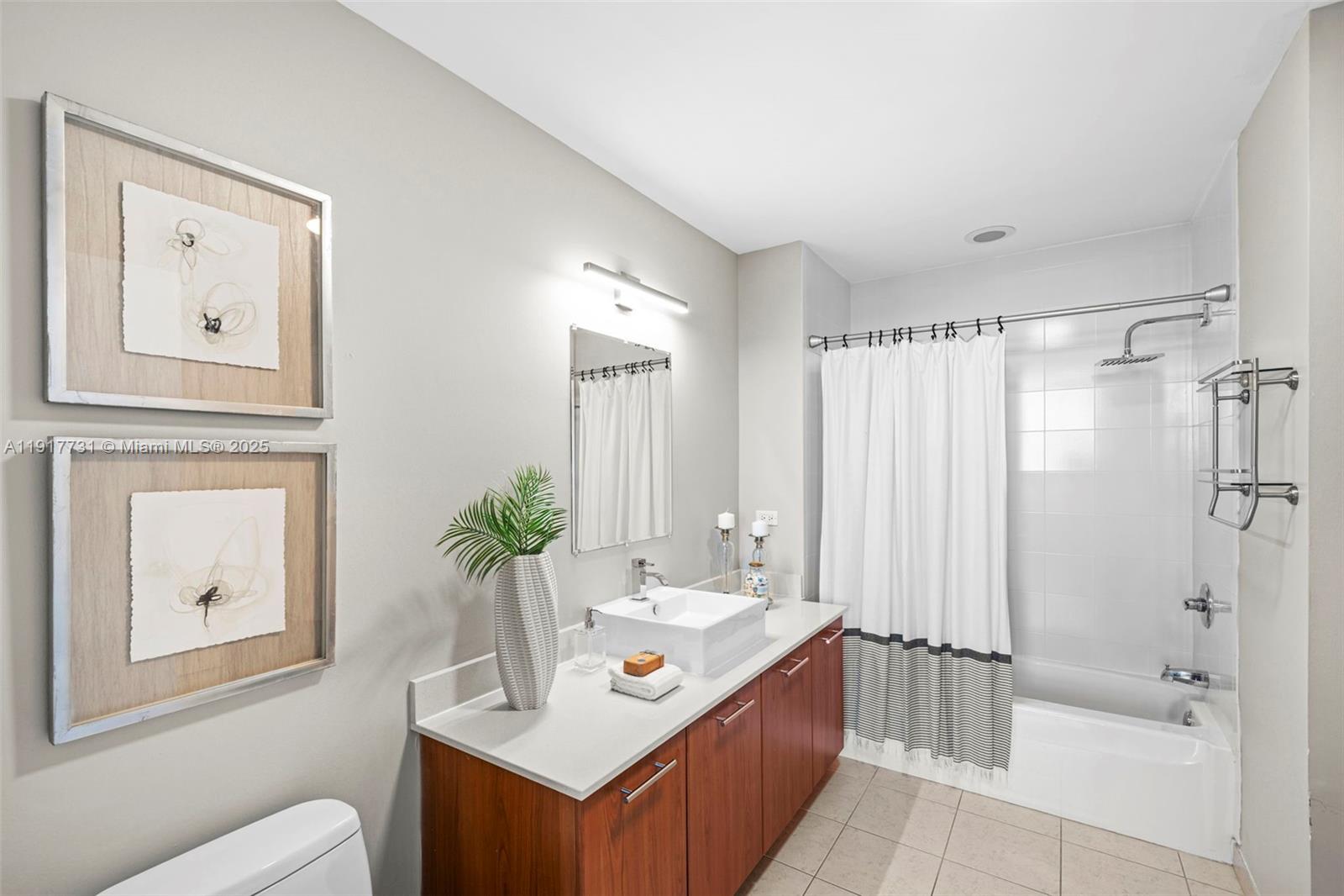 3301 Northeast 1st Avenue, Unit H2201 Miami, FL 33137 - Photo 17 of 46 a bathroom with a sink toilet and shower