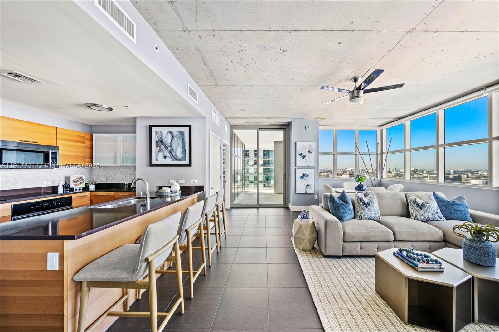 3301 Northeast 1st Avenue, Unit H2201 Miami, FL 33137 - Photo 19 of 46 a living room with furniture and a large window