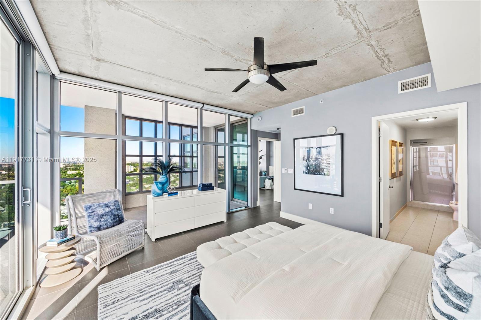 3301 Northeast 1st Avenue, Unit H2201 Miami, FL 33137 - Photo 22 of 46 a bedroom with a bed and large windows