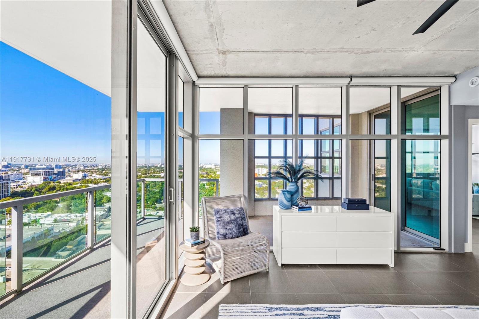 3301 Northeast 1st Avenue, Unit H2201 Miami, FL 33137 - Photo 23 of 46 a living room with large windows and furniture