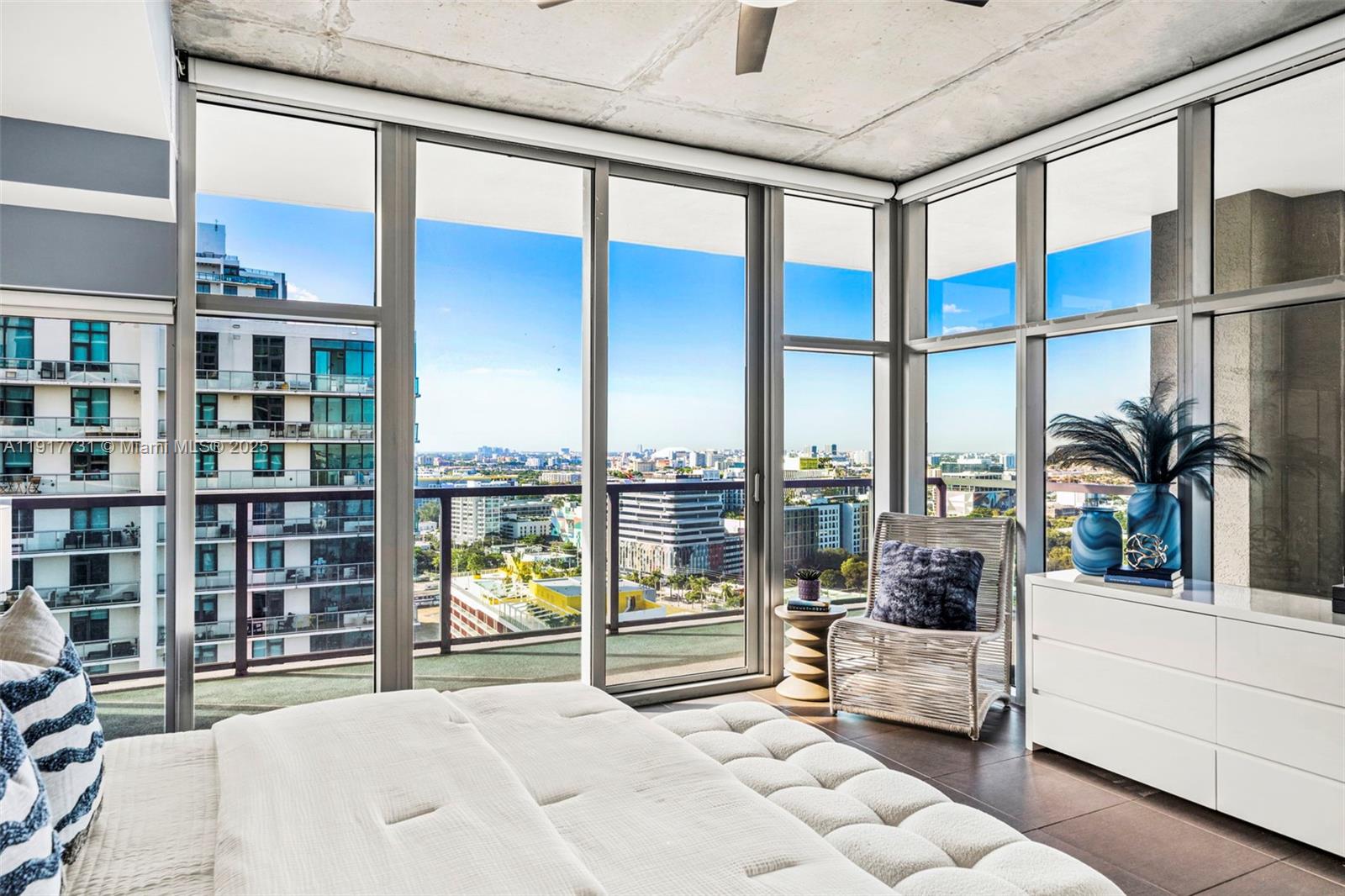 3301 Northeast 1st Avenue, Unit H2201 Miami, FL 33137 - Photo 25 of 46 a bedroom with furniture and large window