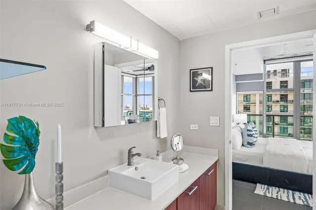 a bathroom with a sink and a mirror