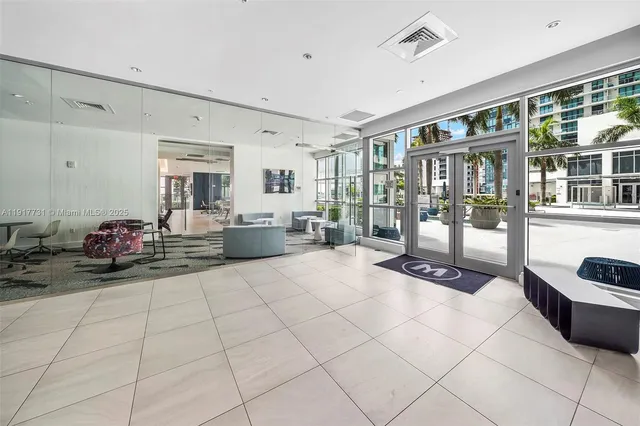 a large room with a lot of furniture and a view of living room