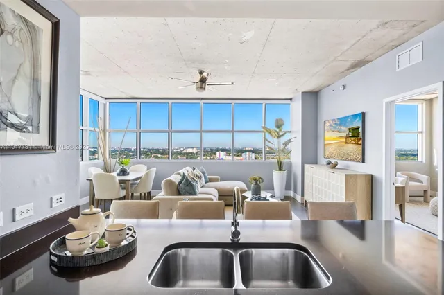 a living room with dining table and chairs