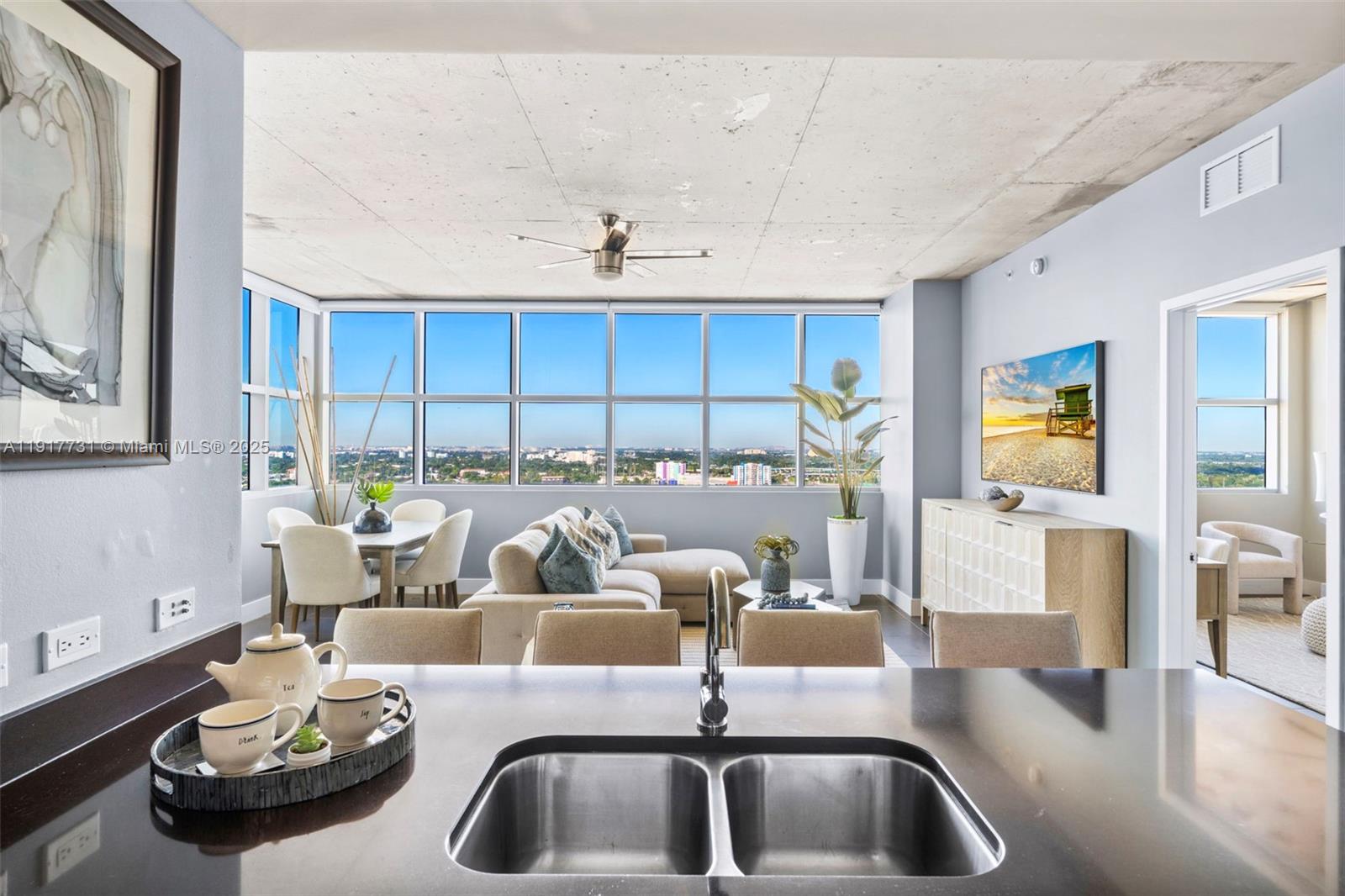 3301 Northeast 1st Avenue, Unit H2201 Miami, FL 33137 - Photo 5 of 46 a living room with dining table and chairs