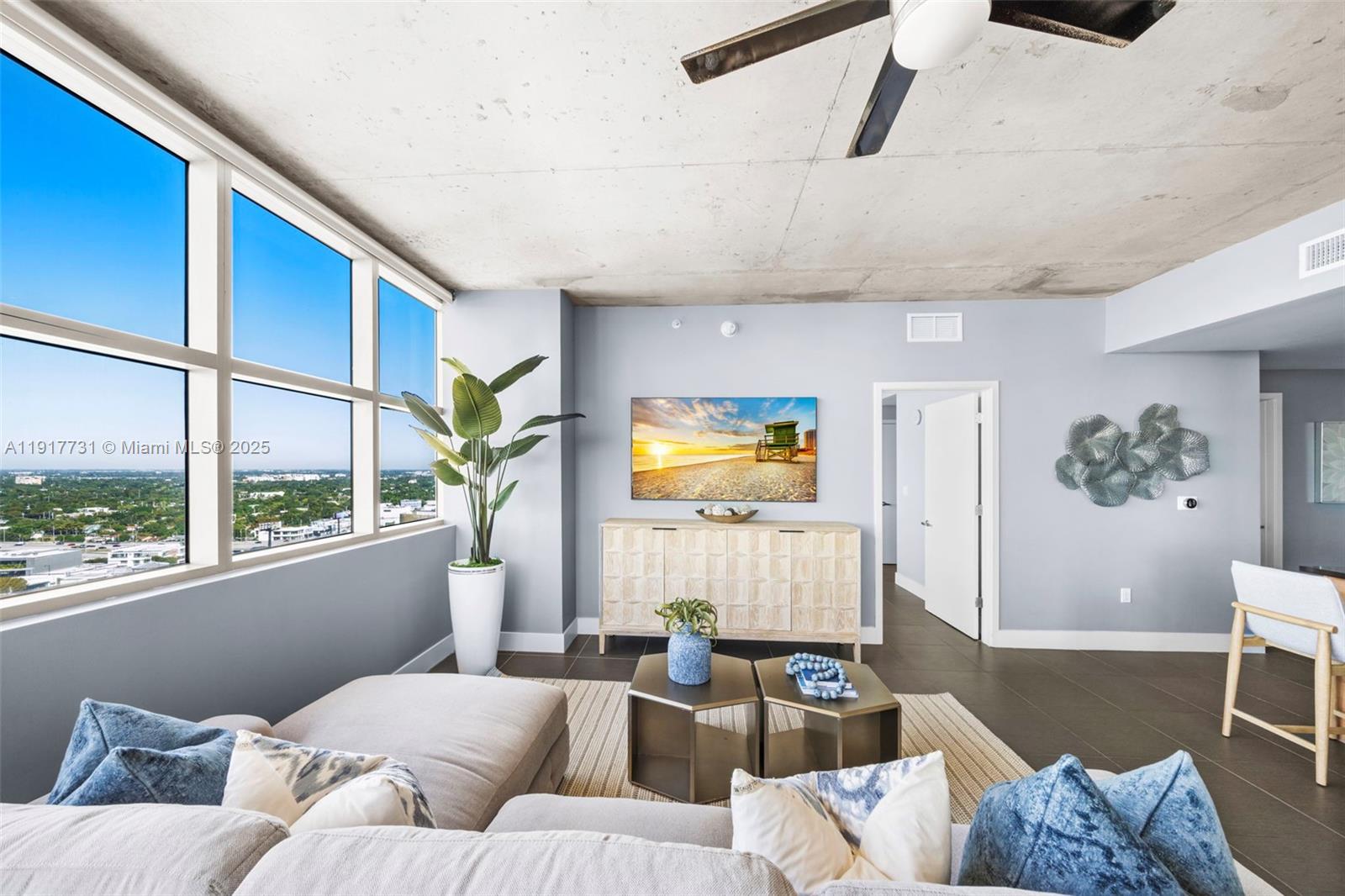 3301 Northeast 1st Avenue, Unit H2201 Miami, FL 33137 - Photo 10 of 46 a living room with furniture wooden floor and a large window