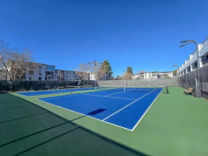 a room with furniture and air hockey table