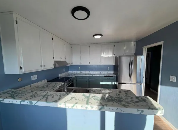 a kitchen with a sink and a stove