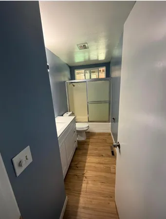 a backyard of a house with large trees and outdoor space