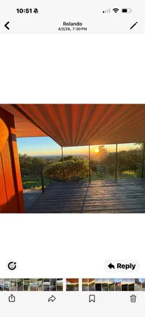 a backyard of a house with barbeque oven and outdoor seating