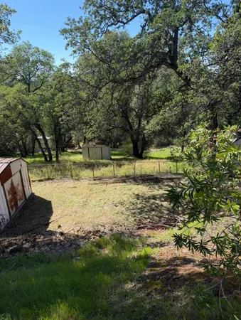 a view of a patio with table and chairs a barbeque with wooden fence