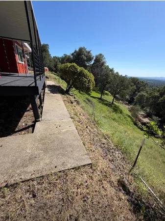 a view of an empty room with a fireplace