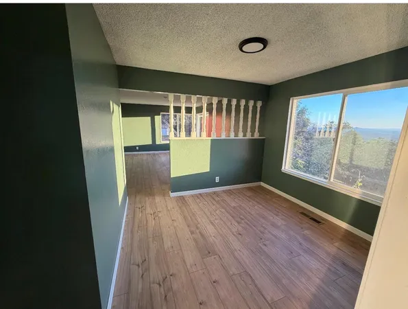 a kitchen with a stove a refrigerator and a sink