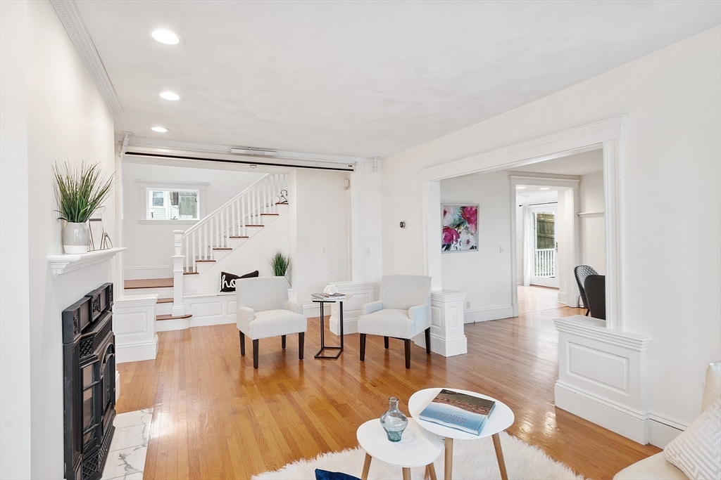 3 Baker Road Nahant, MA 01908 - Photo 22 of 41 a living room with fireplace furniture and a wooden floor
