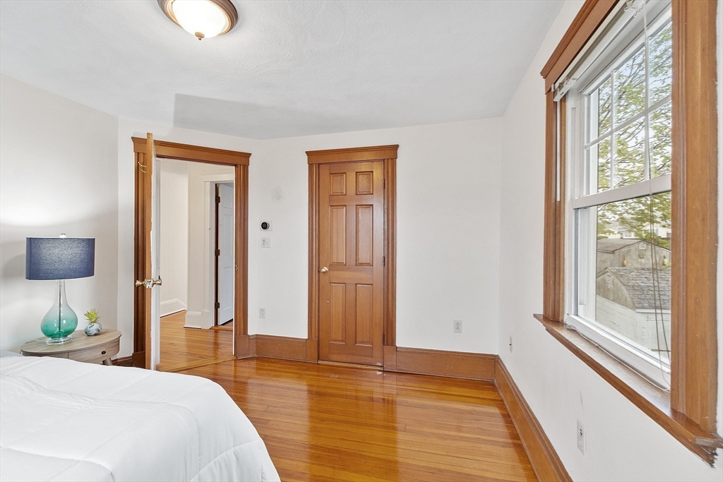 3 Baker Road Nahant, MA 01908 - Photo 30 of 41 a bedroom with a bed and wooden floor