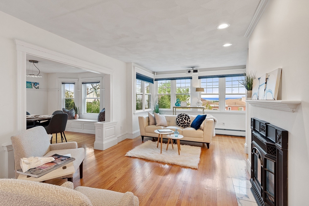 3 Baker Road Nahant, MA 01908 - Photo 3 of 41 a living room with furniture and a fireplace
